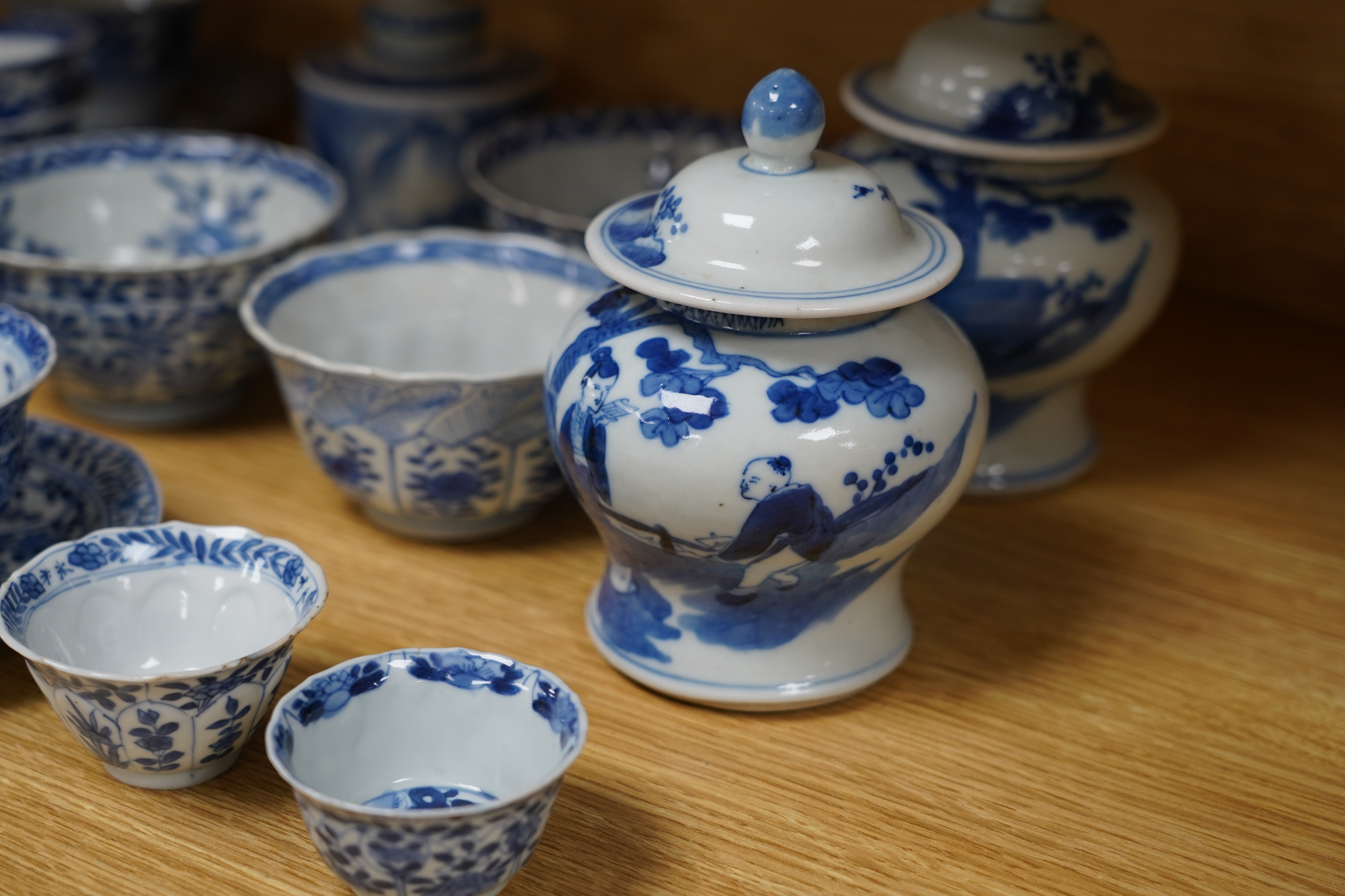 A quantity of 19th century Chinese blue and white porcelain including pair of baluster jars and covers and tea bowls, largest 14cm high